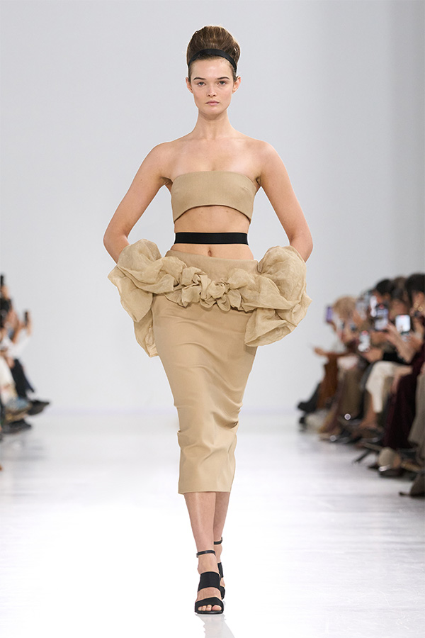 Max Mara Spring/Summer 2026 Fashion Show - Beige Look with bandeau top and ruffle skirt.
